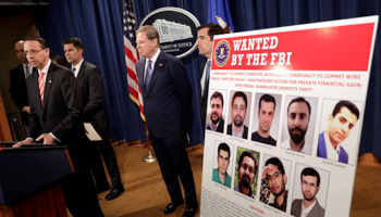 US Deputy Attorney General Rod Rosenstein speaks at a news conference with other law enforcement officials at the Justice Department to announce nine Iranians charged with conducting massive cyber theft campaign, in Washington, March 23 (Reuters/Yuri Gripas)