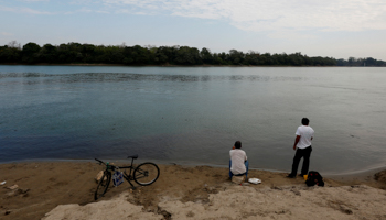Men fish on the banks of the Usumacinta River in Tenosique, Tabasco (Reuters/Carlos Jasso)