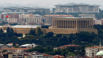 The new presidential palace complex (background) in Ankara dwarfs Ataturk’s mausoleum (centre, with flag) (Reuters/Umit Bektas)