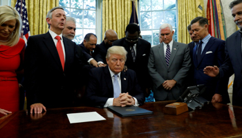 Faith leaders pray with Trump, Pence and others in the Oval Office for Hurricane Harvey victims (Reuters/Kevin Lamarque)