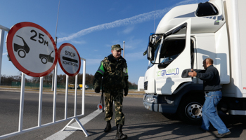 A truck stops at a checkpoint on the Belarusian border with Poland (Reuters/Vasily Fedosenko)