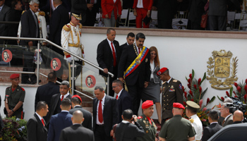 President Nicolas Maduro flanked by military personnel at a parade last month (Reuters/Marco Bello)