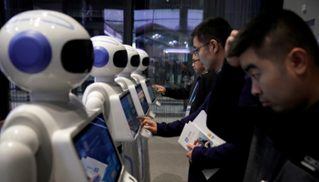 People look at Xiao Qiao robots during the fourth World Internet Conference in Wuzhen, Zhejiang province, China (Reuters/Aly Song)