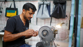 Migrant Abid Ali from Pakistan works as tailor and designer (Reuters/Hannibal Hanschke)