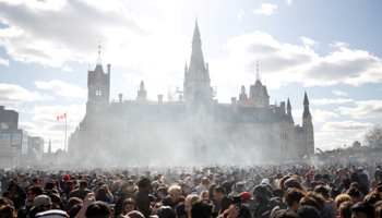 Smoke rises during the annual 4/20 marijuana rally on Parliament Hill in Ottawa, Ontario, Canada, April 20, 2018 (Reuters/Chris Wattie)