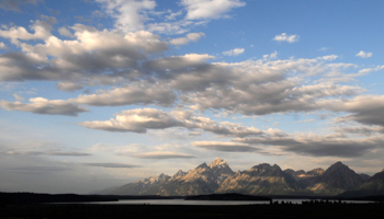 Morning sun hits the Grand Tetons as bankers and economists gather at the Jackson Hole Economic Symposium in Grand Teton National Park, August 27, 2010 (Reuters/Price Chambers)