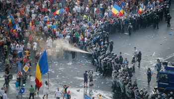 Police use pepper spray on protesters in Bucharest, August 10 (Reuters/Adriana Neagoe)