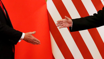 US President Donald Trump and China's President Xi Jinping shake hands at the Great Hall of the People in Beijing, November 2017 (Reuters/Damir Sagolj)