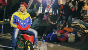Venezuelan migrants take refuge inside a tent at the Rumichaca International Bridge, Ecuador August 17 (Reuters/Luisa Gonzalez)