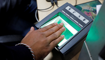 A woman has her finger prints scanned for her Aadhaar card in Delhi, India  (Reuters/Saumya Khandelwal)