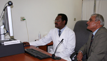 Doctor Asfaw Atnafu, head of telemedicine at the Black Lion hospital in Addis Ababa, uses a high-speed Internet connection to communicate with doctors at Care Hospital Hyderabad in India (Reuters/Barry Malone)