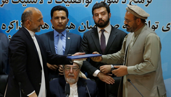 Hanif Atmar (L), as National Security Adviser, at a ceremony marking the return to politics of the insurgent Hezb-e Islami party (Reuters/Omar Sobhani)