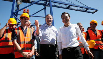 Greek Prime Minister Antonis Samaras (3rd L) and Chinese Premier Li Keqiang (3rd R) in the port of Piraeus, where China’s Cosco controls two container terminals (Reuters/Petros Giannakouris)