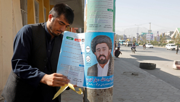 Posters go up in Kabul ahead of the October 20 parliamentary election (Reuters/Omar Sobhani)