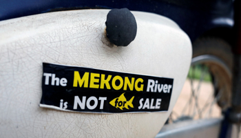 A sticker is seen at the Thailand side of the Mekong River, at the border between Laos and Thailand April 23, 2017 (Reuters/Jorge Silva)