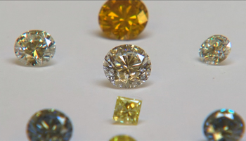 Coloured synthetic diamonds on display at De Beers' International Institute of Diamond Grading and Research in Maidenhead (Reuters/Reuters TV)