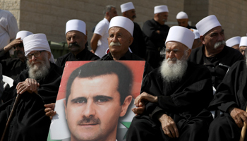 Druze people hold a rally in Majdal Shams near the ceasefire line between Israel and Syria in the Israeli occupied Golan Heights October 6 (Reuters/Ammar Awad)