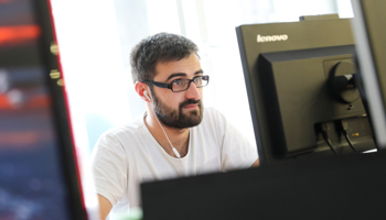 A programmer works on a computer in Belgrade, Serbia (Reuters/Marko Djurica)