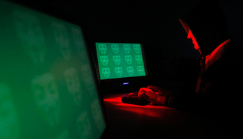 A display showing the word 'cyber' in binary code (Reuters/Dado Ruvic)