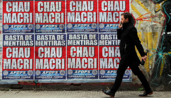 Posters reading “Enough lies: Goodbye Macri” (Reuters/Marcos Brindicci)