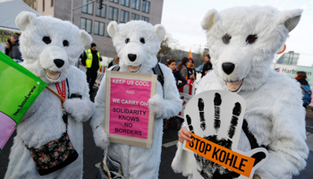 Environmental activists dressed in fancy costumes take part in an anti-coal protest on the occasion of the Katowice Climate Change Conference in front of the Chancellery in Berlin, Germany December 1 (Reuters/Fabrizio Bensch)