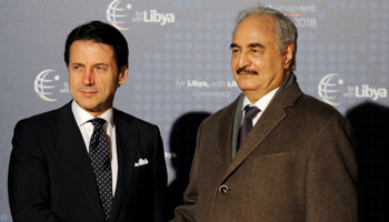 Italy's Prime Minister Giuseppe Conte welcomes Libyan military commander Khalifa Haftar as he arrives at the venue of the international conference on Libya in Palermo, Italy, November 12 (Reuters/Guglielmo Mangiapane)