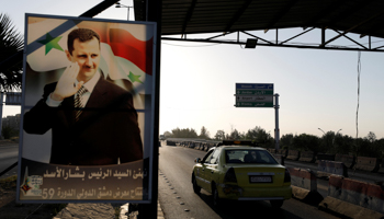 A poster of President Bashar al-Assad on the road to Damascus airport, April 2018 (Reuters/Omar Sanadiki)