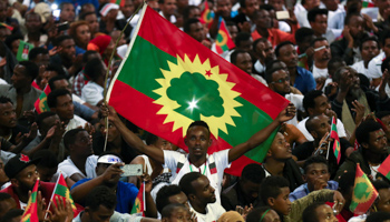 A man holding an Oromo Liberation Front flag (Reuters/Tiksa Negeri)