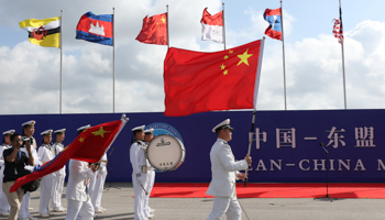 Members of the Chinese People's Liberation Army and navy hold flags during the opening ceremony of the first China-ASEAN Maritime Exercise in Guangdong province, October 2018 (Reuters/Stringer)