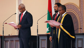 President Ibrahim Mohamed Solih (left) and Qasim Ibrahim (centre) at Solih’s inauguration (Reuters/Ashwa Faheem)