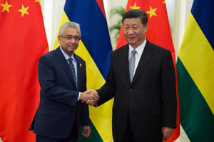 Mauritian Prime Minister Pravind Jugnauth shakes hands with China's President Xi Jinping before a bilateral meeting in September 2018 (Reuters/Nicolas Asfouri)