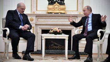 Belarusian President Alexander Lukashenka (L) with Russia’s Vladimir Putin in the Kremlin, December 25 (Reuters/Alexander Nemenov)