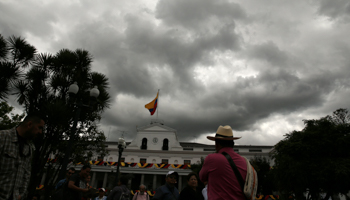 Clouds gather over the government palace in Quito, Ecuador (Reuters/Mariana Bazo)