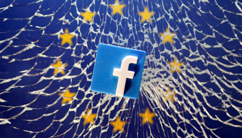 A 3D printed Facebook logo on broken glass above a printed EU flag (Reuters/Dado Ruvic)