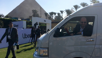 Uber CEO Dara Khosrowshahi sits in a new bus after a news conference in Cairo, December 2018 (Reuters/Lena Masri)