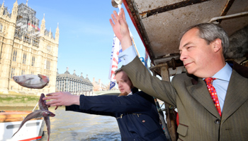 Brexit campaigner Nigel Farage and the founder of Fishing for Leave, Aaron Brown, symbolically dump fish into the River Thames to highlight the need to leave the Common Fisheries Policy, March 2018 (Reuters/Toby Melville)