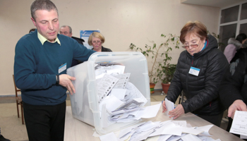 Counting votes in Chisinau in the February 24 parliamentary election (Reuters/Vladislav Culiomza)