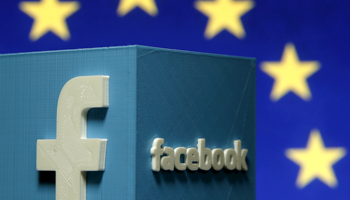 A 3D-printed Facebook logo in front of the logo of the EU (Reuters/Dado Ruvic)