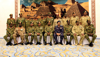 President Omar al-Bashir poses for a photograph after swearing in military governors for Sudan’s 18 states (Reuters/Mohamed Nureldin Abdallah)