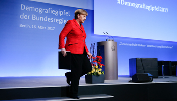 German Chancellor Angela Merkel leaves the stage after her speech at the demographic summit in Berlin, March 16 2017 (Reuters/Fabrizio Bensch)