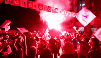 Supporters of the Islamist Ennahda party celebrate outside the party's headquarters after claiming victory in a local poll in Tunis, Tunisia, May 6, 2018 (Reuters/Zoubeir Souissi)