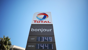 Total’s logo above a petrol station in Cape Town (Reuters/Mike Hutchings)