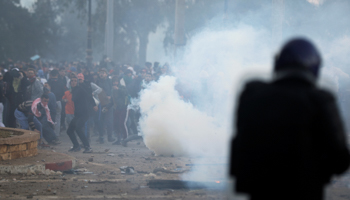 Anti-riot police officers clash with people protesting against President Abdelaziz Bouteflika's plan to extend his 20-year rule by seeking a fifth term in April elections in Algiers, Algeria, March 1 (Reuters/Zohra Bensemra)