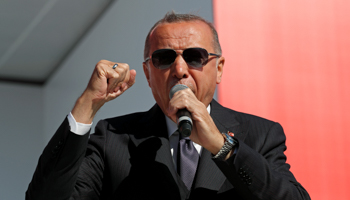 President Erdogan makes a fist as he addresses supporters at a rally for the March 31 local elections, Istanbul, March 24 (Reuters/Umit Bektas)