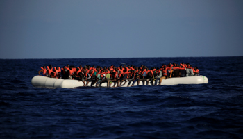 An overcrowded dinghy with migrants from different African countries during a rescue operation, off the Libyan coast in the Mediterranean Sea, 2016 (Reuters/Zohra Bensemra)
