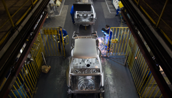 Workers on the production line at the Iran Khodro car manufacturing plant, June 2011 (Reuters/Morteza Nikoubazl)