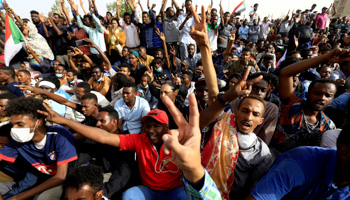 Sudanese demonstrators cheer at a protest demanding President Omar Al-Bashir resign in Khartoum April 11 (Reuters/Stringer)