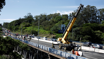 People work on the construction of a bridge on a freeway in San Jose, Costa Rica (Reuters/Juan Carlos Ulate)