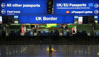 UK Border control is seen in Terminal 2 at Heathrow Airport in London June 4, 2014 (Reuters/Neil Hall)