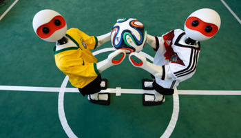 Robots competing in the 2014 'RoboCup' robotics championship in Brazil (Reuters/Ina Fassbender)